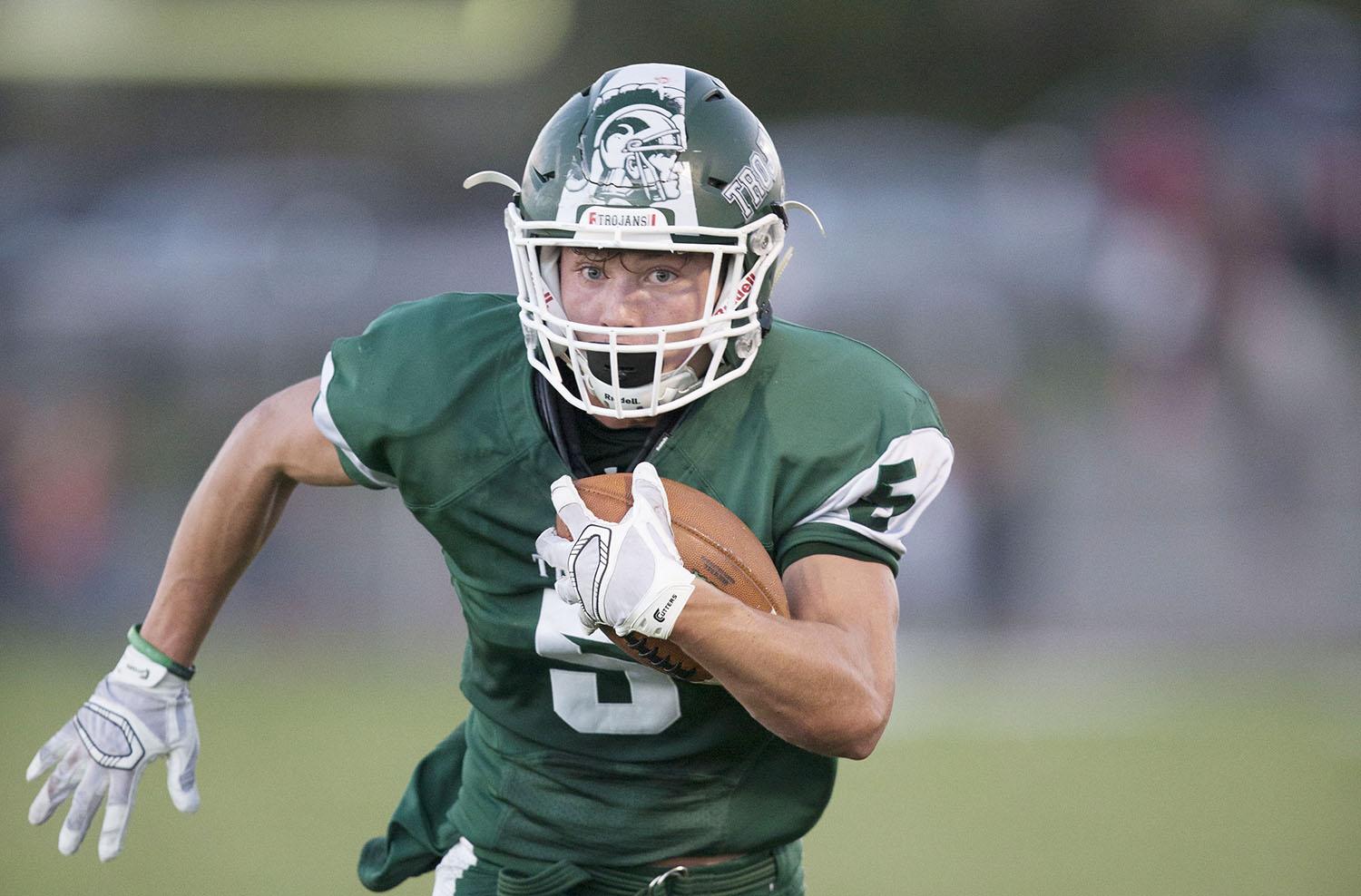 During the Oil Bowl in early October, senior Sam Marsh races toward the end zone. The Trojans won an important game against the Mustangs that will take part in deciding where the Trojans will be seeded for state.