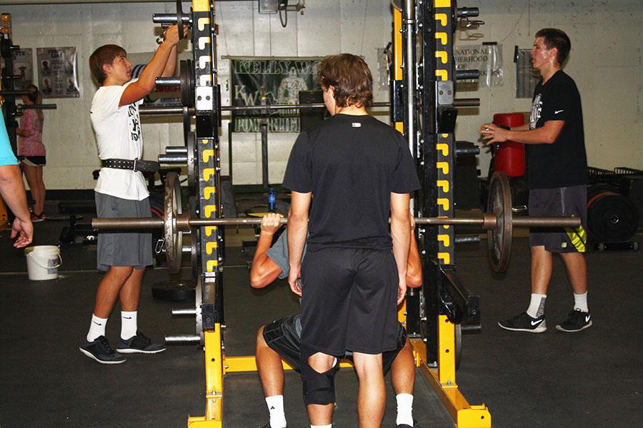 Joey Geil, Trey Jennings and Joel Strube work with weights during their conditioning ed. class. Though all three are KW athletes, the class is not just for athletes. Anyone who wants to take a more rigorous P.E. class to get in shape is welcome to take the class.