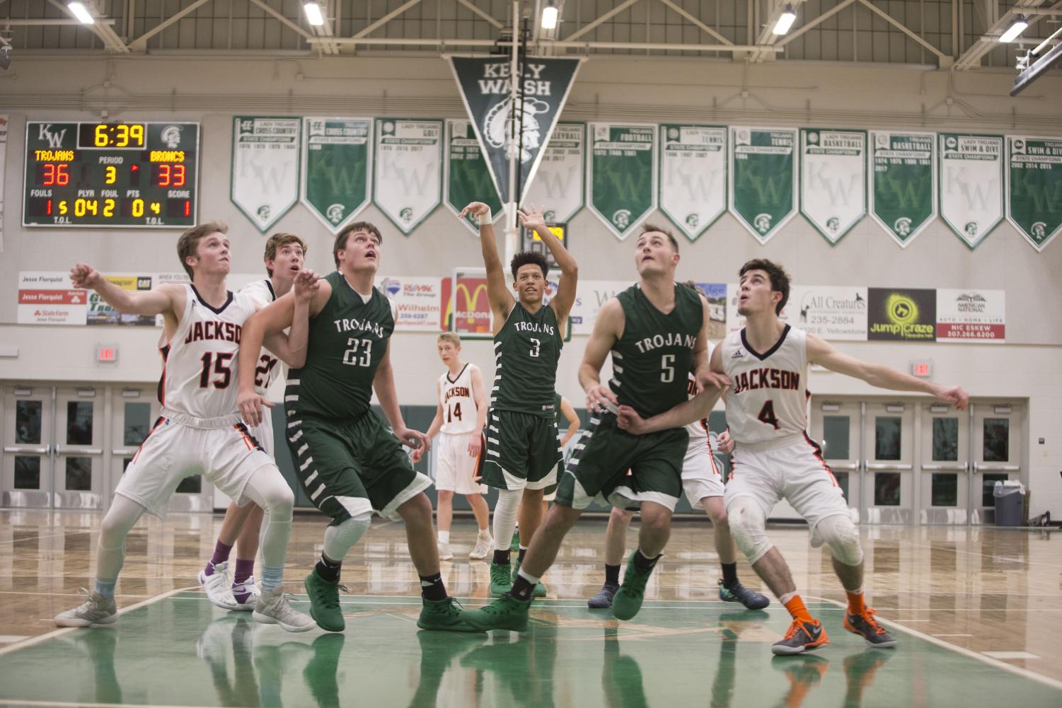 Junior Davion McAdam shoots a free throw during the Fremont Classic held here at Kelly Walsh December 7th-9th. The Trojans only have one senior on the team this year making it a rebuilding year for the Trojan program.