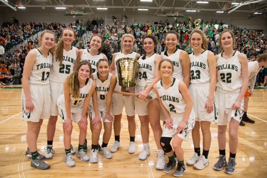 The Lady Trojans pose with the Peach Basket Trophy for the first time in 8 years.  The Lady Trojans won 51-42.  The Trojans also won the trophy on the boys side with a final score of 55-47.  This is the first time both trophies will both be at KW since 1996.