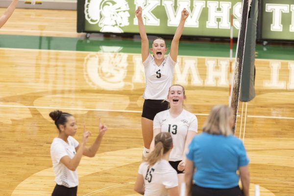 Gia Ireland, Lillian Hudson, Kendal Allaire and Madyn Waring celebrate a point against the Natrona Fillies in the Pre-VolleyBowl on September 26 in the KW gym.