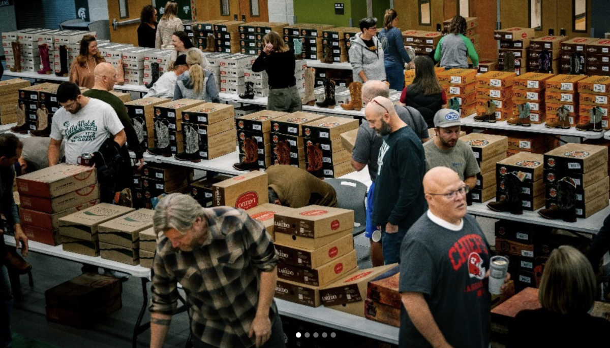 KW teachers peruse different styles of boots during the Jae Foundation boot distribution held during teacher professional development day on October 28.